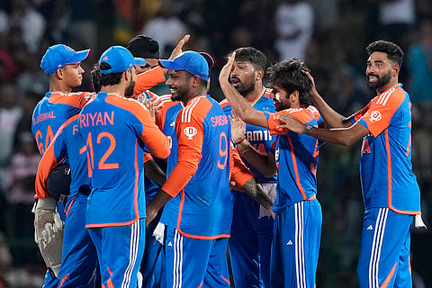 Ravi Bishnoi is congratulated for taking the wicket of Pathum Nissanka